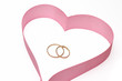 Wedding rings in heart from a tape