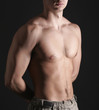 Young Sporty Man over Black Background, Body Parts