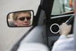 Woman in Side-View Mirror of Car