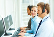 Photo: Successful business people working on separate computers Successful business people working on separate computers