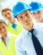 Group of successful construction workers standing together