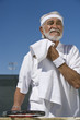 Tennis player toweling face