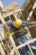 construction worker measuring building