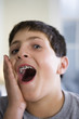 Close up of a boy making facial expression..