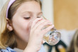 View of girl drinking water..