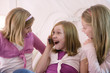 View of three surprised girls.