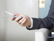 Close up of a man holding mobile phone.
