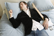 Photo: Man sleeping in bed with guitar. Man sleeping in bed with guitar.
