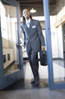 A young business man entering an office.