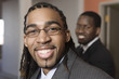 Portrait of a young businessmen smiling.