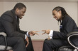 Businessmen playin "Rock Paper Scissors ".
