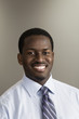 Portrait of a business man smiling in an office.