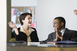Photo: Business colleagues clapping in an office. Business colleagues clapping in an office.