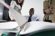 Foto: Business people smiling in office. Business people smiling in office.