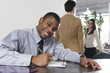 Business man writing with business colleagues