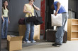 Photo: Friends moving out with their belongings. Friends moving out with their belongings.