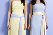 Midsection of two bridesmaids standing.