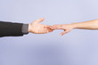 Close up of hands touching.