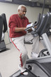 senior man exercising on stationary bike