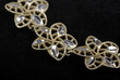 Armlet made of flowers isolated on black velvet background.