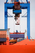 shipping container loading cargo in harbor