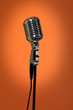 Vintage Microphone Over Orange Background Vintage Microphone Over Orange Background