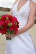 holding red flower bouquet holding red flower bouquet