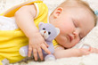 Foto: Baby sleeping with her bear toy Baby sleeping with her bear toy