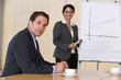 confident business woman giving presentation