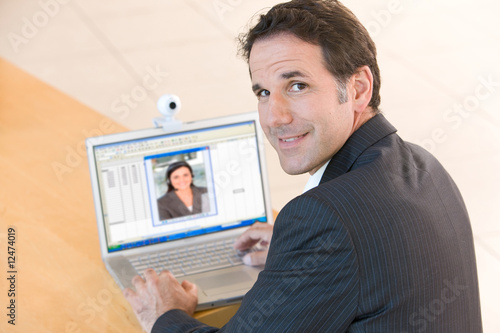 Photo: Senior business man working on laptop Senior business man working on laptop