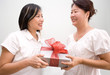 Gift giving between two asian ladies