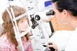 Beautiful young doctor inspect a patient in ophthalmology labor Beautiful young doctor inspect a patient in ophthalmology labor
