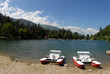 Water bicycles on the bank of mountain lake.