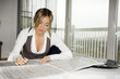 beautiful young woman reding newspaper