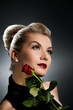 Charming lady with red rose