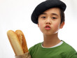 vive la france,  child carrying baguette says salut