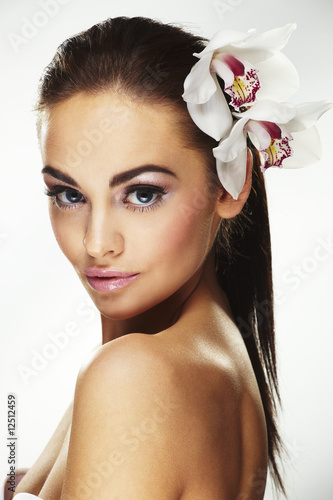 Photo: Sexy young woman with flowers Sexy young woman with flowers