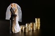wedding couple figurine and golden coins