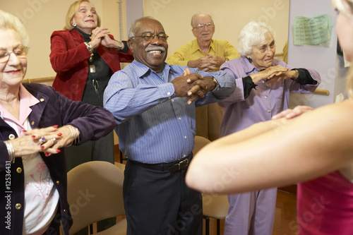 Photo: Senior adults in a stretching class Senior adults in a stretching class