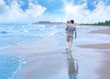 Father and Son Walking on the Suuny Beach
