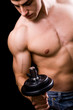 Bodybuilder in action - muscular powerful man lifting weights
