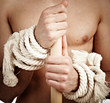 man with a cord on hands