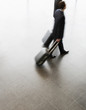 Two businessmen standing with suitcases