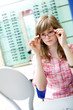 Teen girl choose an glasses Teen girl choose an glasses