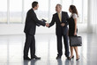 A letting agent showing business people around empty office
