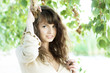Girl with blue eyes in the foliage