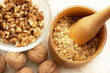 Walnuts: full, cracked and grinded. Focus on masher.