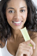 A woman holding a stick of celery