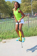 Photo: Girl jumping on pogo stick Girl jumping on pogo stick