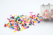 Spilled sprinkles isolated on white.